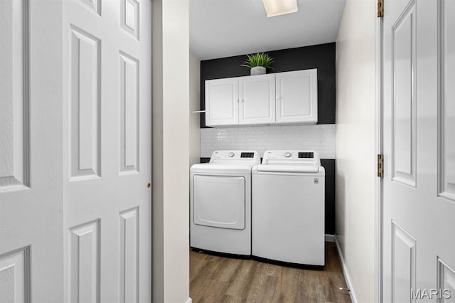 2711 Cascade Lake Dr, Shiloh, IL 62221 - laundry area with separate washer and dryer, dark wood-style floors, cabinet space, and baseboards