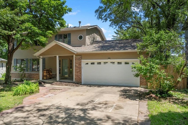 1014 Willow River Ct, Florissant, MO 63031 - traditional-style house featuring brick siding, a garage, driveway, and covered porch