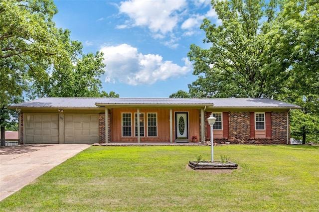 330 Mont Divier Dr, Bonne Terre, MO 63628 - ranch-style home with an attached garage, covered porch, driveway, and a front yard