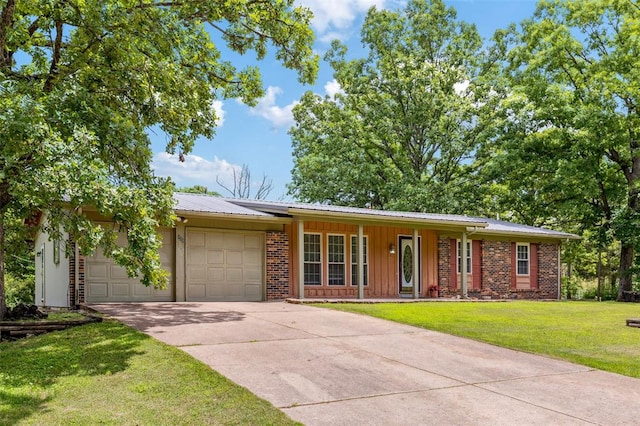 330 Mont Divier Dr, Bonne Terre, MO 63628 - ranch-style house with a garage, a porch, concrete driveway, a front lawn, and metal roof