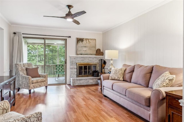 330 Mont Divier Dr, Bonne Terre, MO 63628 - living area featuring ornamental molding, a ceiling fan, light wood-style flooring, and a glass covered fireplace