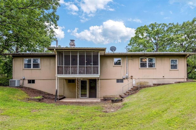 330 Mont Divier Dr, Bonne Terre, MO 63628 - rear view of property with a chimney, a sunroom, a patio area, a lawn, and cooling unit