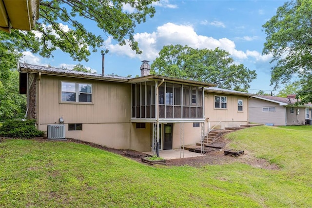 330 Mont Divier Dr, Bonne Terre, MO 63628 - back of house with a sunroom, a chimney, a patio, a yard, and central AC unit