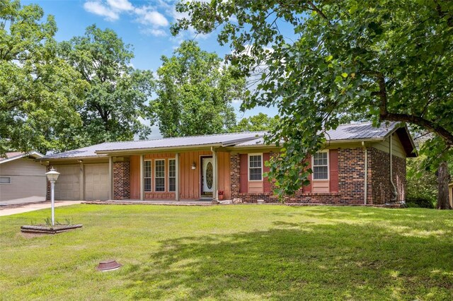 330 Mont Divier Dr, Bonne Terre, MO 63628 - single story home featuring an attached garage, a porch, a front lawn, and driveway
