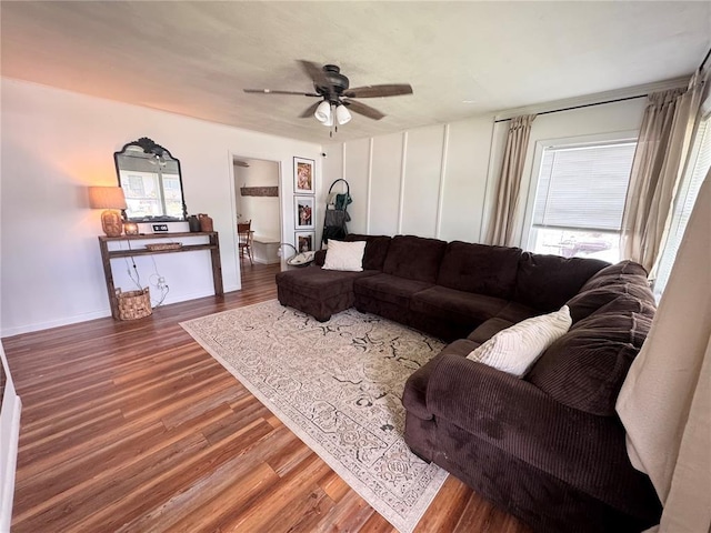517 W Olive St, Palmyra, MO 63461 - living area featuring wood finished floors, ceiling fan, and baseboards