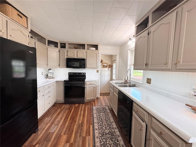 517 W Olive St, Palmyra, MO 63461 - kitchen with black appliances, a sink, dark wood-type flooring, light countertops, and open shelves