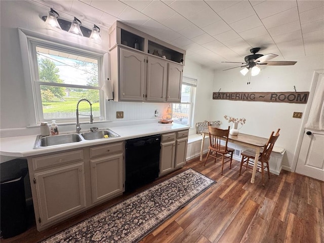 517 W Olive St, Palmyra, MO 63461 - kitchen with dishwasher, a sink, dark wood-style flooring, light countertops, and a ceiling fan