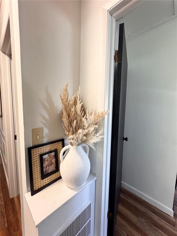 517 W Olive St, Palmyra, MO 63461 - detailed view of wood finished floors and baseboards