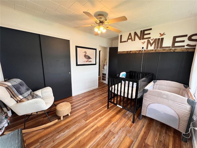517 W Olive St, Palmyra, MO 63461 - bedroom featuring wood finished floors, ceiling fan, and a closet
