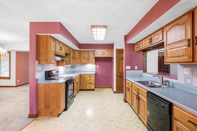 513 Matthews Ln, Waterloo, IL 62298 - kitchen with black appliances, under cabinet range hood, a sink, and baseboards