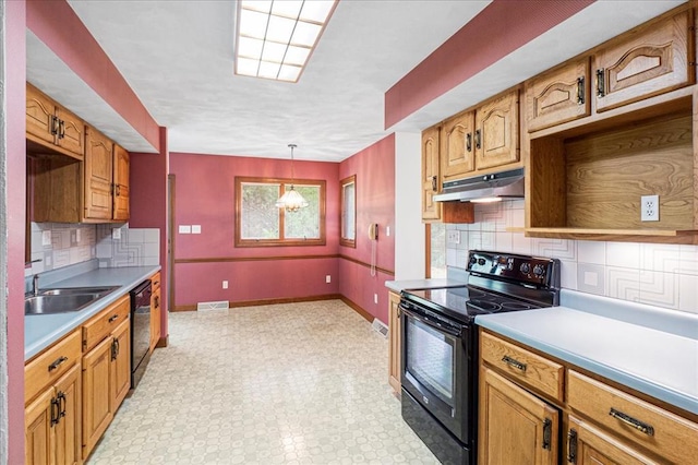 513 Matthews Ln, Waterloo, IL 62298 - kitchen with black appliances, under cabinet range hood, a sink, backsplash, and light countertops