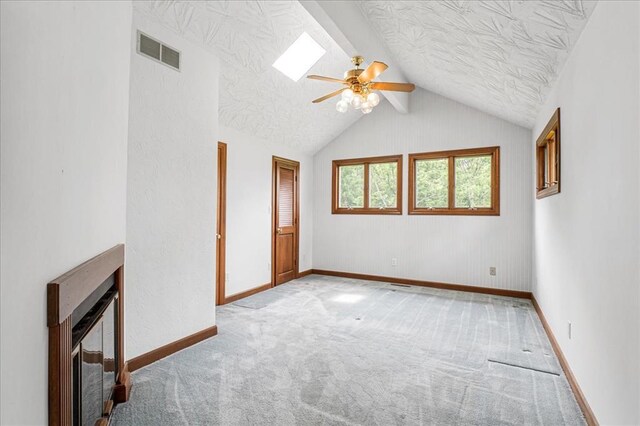 513 Matthews Ln, Waterloo, IL 62298 - unfurnished living room with a ceiling fan, beverage cooler, carpet floors, a textured ceiling, and vaulted ceiling