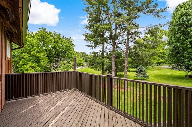 513 Matthews Ln, Waterloo, IL 62298 - wooden deck with a lawn and view of wooded area