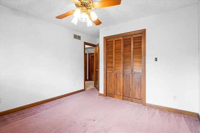 513 Matthews Ln, Waterloo, IL 62298 - unfurnished bedroom with carpet floors, a closet, baseboards, and a ceiling fan