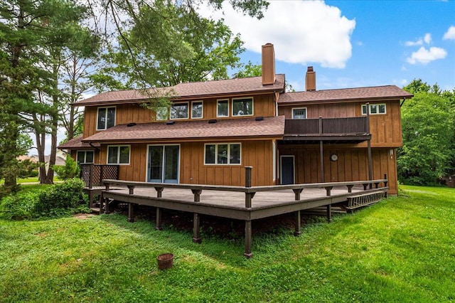 513 Matthews Ln, Waterloo, IL 62298 - back of property with a chimney, a yard, and a wooden deck