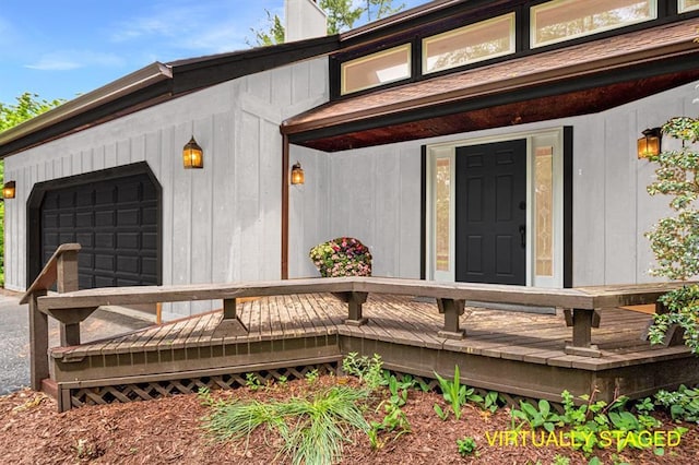 513 Matthews Ln, Waterloo, IL 62298 - doorway to property featuring a deck and a garage