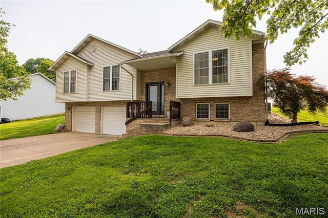 781 N W Ln, Jackson, MO 63755 - split foyer home featuring brick siding, an attached garage, a front lawn, and driveway