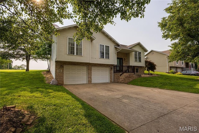 781 N W Ln, Jackson, MO 63755 - raised ranch featuring brick siding, an attached garage, a front yard, and driveway