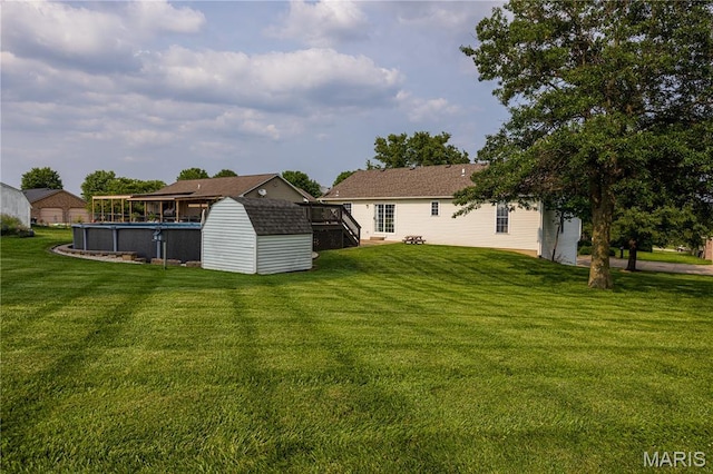 781 N W Ln, Jackson, MO 63755 - view of green lawn with a wooden deck and an outdoor pool