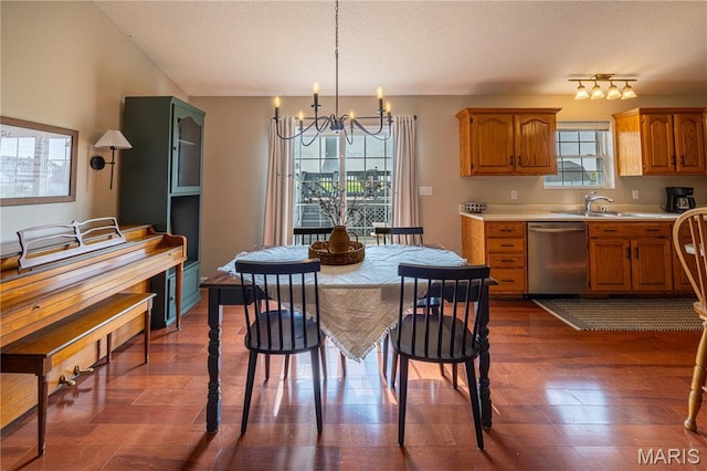 781 N W Ln, Jackson, MO 63755 - kitchen featuring dishwasher, a chandelier, light countertops, a sink, and brown cabinets