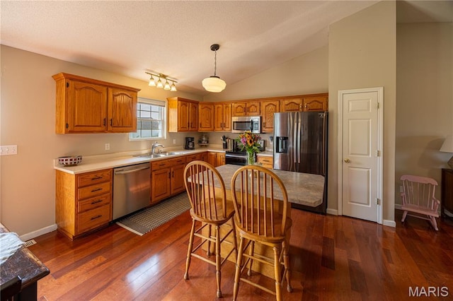 781 N W Ln, Jackson, MO 63755 - kitchen featuring stainless steel appliances, dark wood finished floors, a sink, brown cabinets, and light countertops