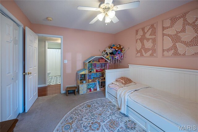 781 N W Ln, Jackson, MO 63755 - bedroom with carpet, a ceiling fan, a wainscoted wall, and a closet