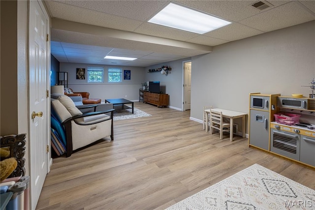 781 N W Ln, Jackson, MO 63755 - living room with a paneled ceiling, light wood-style flooring, and baseboards