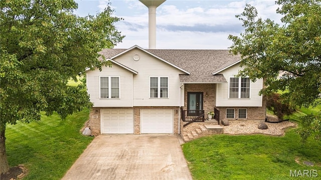 781 N W Ln, Jackson, MO 63755 - bi-level home featuring brick siding, driveway, an attached garage, a front yard, and roof with shingles
