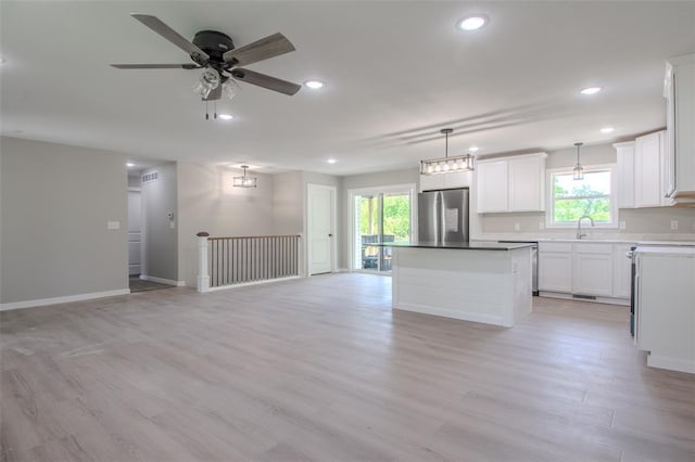 405 Julie Ln, Holts Summit, MO 65043 - kitchen featuring stainless steel fridge, healthy amount of natural light, a center island, open floor plan, and recessed lighting