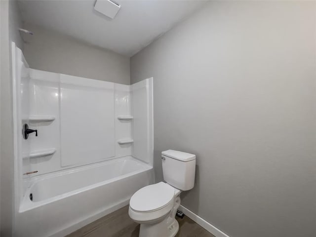 405 Julie Ln, Holts Summit, MO 65043 - full bath with toilet, baseboards, tub / shower combination, and wood finished floors