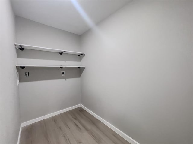 405 Julie Ln, Holts Summit, MO 65043 - laundry room with hookup for an electric dryer, wood finished floors, and baseboards
