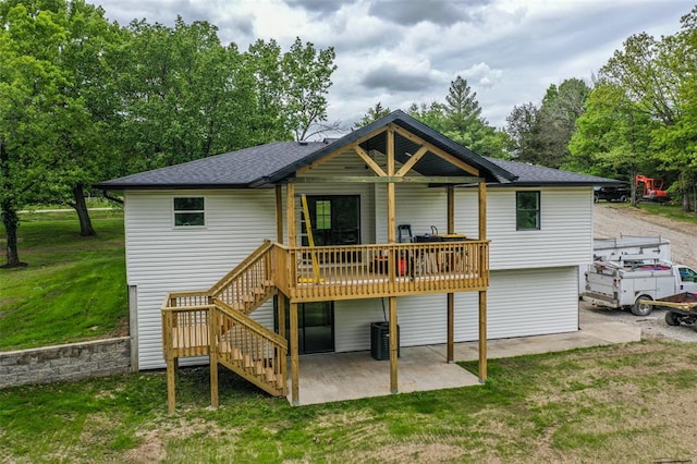 405 Julie Ln, Holts Summit, MO 65043 - rear view of property featuring a yard, stairs, a patio area, a wooden deck, and central air condition unit