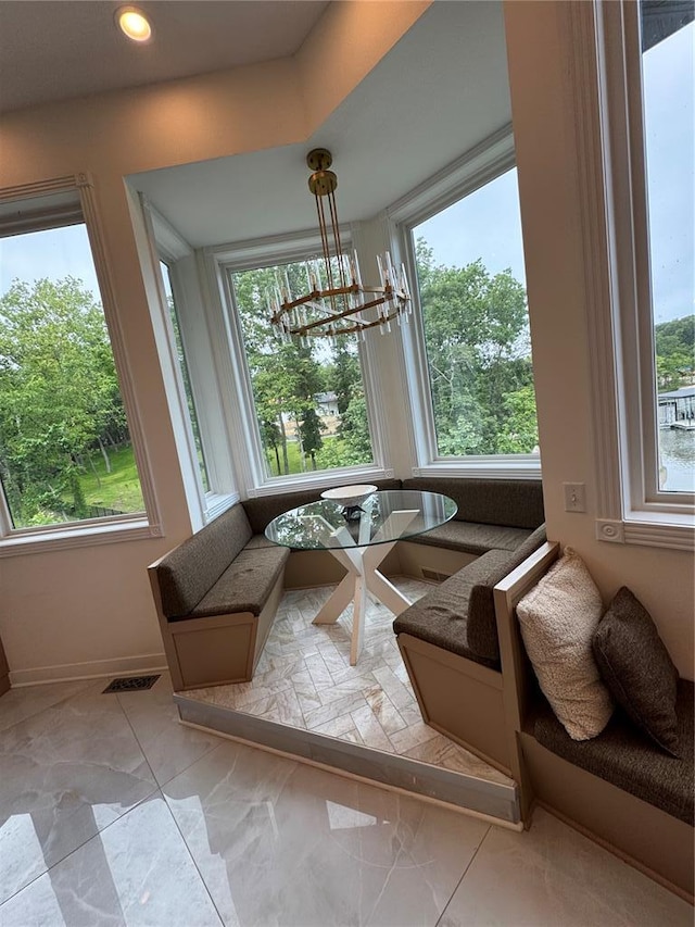 149 Thornwood Cir, Sunrise Beach, MO 65079 - dining room featuring breakfast area, baseboards, a chandelier, and recessed lighting