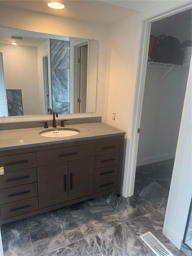 149 Thornwood Cir, Sunrise Beach, MO 65079 - bathroom featuring vanity and a spacious closet