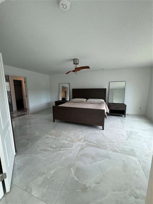 149 Thornwood Cir, Sunrise Beach, MO 65079 - bedroom featuring a textured ceiling, light marble finish floors, and ceiling fan