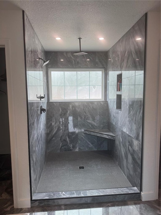 149 Thornwood Cir, Sunrise Beach, MO 65079 - full bathroom featuring a textured ceiling and walk in shower