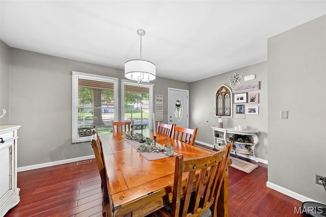 2917 Royal Gorge Ct, Oakville Township, MO 63129 - dining area featuring dark wood-style floors, baseboards, and a chandelier