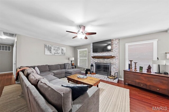 2917 Royal Gorge Ct, Oakville Township, MO 63129 - living area with ceiling fan, wood finished floors, a brick fireplace, and baseboards