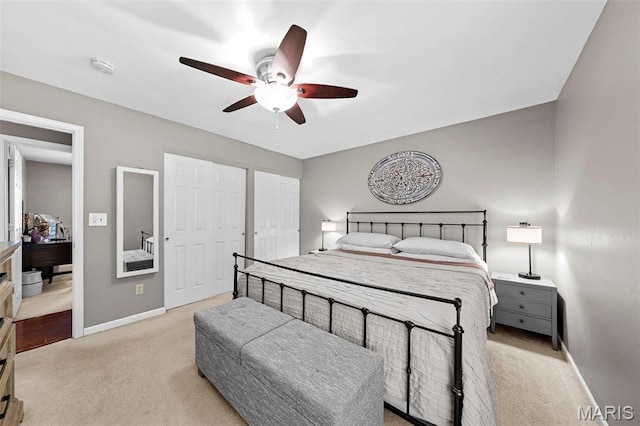 2917 Royal Gorge Ct, Oakville Township, MO 63129 - bedroom featuring light colored carpet, baseboards, two closets, and a ceiling fan