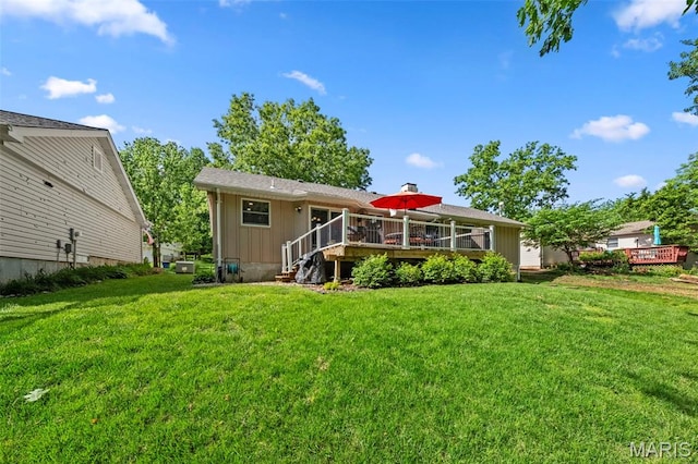 2917 Royal Gorge Ct, Oakville Township, MO 63129 - rear view of property featuring a deck, a lawn, and board and batten siding