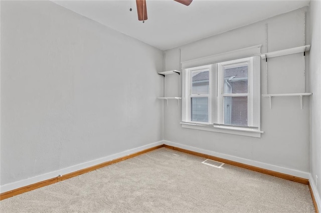 8838 Argyle Ave, Overland, MO 63114 - spare room with baseboards, carpet floors, and ceiling fan