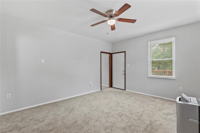 8838 Argyle Ave, Overland, MO 63114 - spare room featuring carpet, a ceiling fan, and baseboards