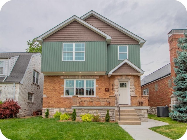 6343 Tholozan, Saint Louis, MO 63109 - view of front of house with board and batten siding, a front lawn, brick siding, and central AC unit