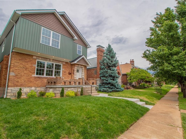 6343 Tholozan, Saint Louis, MO 63109 - view of front of home with brick siding and a front lawn