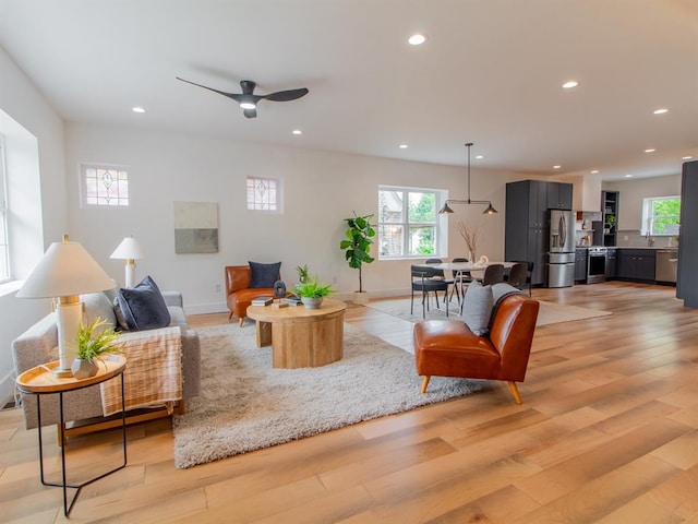6343 Tholozan, Saint Louis, MO 63109 - living area with recessed lighting, plenty of natural light, light wood-style flooring, and ceiling fan