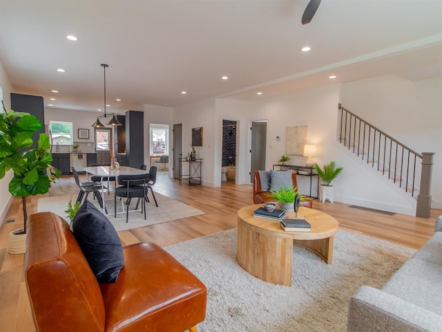 6343 Tholozan, Saint Louis, MO 63109 - living room featuring wood finished floors, recessed lighting, stairway, baseboards, and a ceiling fan