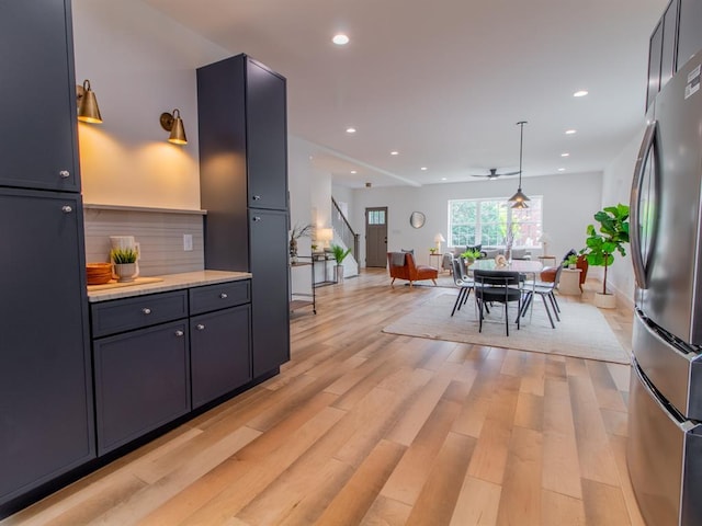 6343 Tholozan, Saint Louis, MO 63109 - kitchen with freestanding refrigerator, light countertops, open floor plan, light wood-type flooring, and recessed lighting