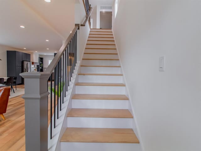 6343 Tholozan, Saint Louis, MO 63109 - stairway featuring recessed lighting and wood finished floors