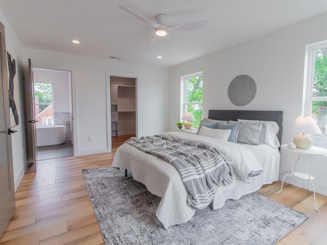 6343 Tholozan, Saint Louis, MO 63109 - bedroom with multiple windows, a spacious closet, light wood-style flooring, and recessed lighting