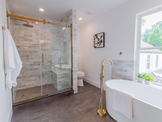 6343 Tholozan, Saint Louis, MO 63109 - full bathroom featuring a freestanding bath, a stall shower, toilet, baseboards, and tile patterned floors